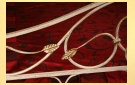 Декоративные кованые элементы задней спинки кованой кровати Березайка